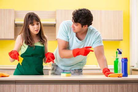 Young couple working at kitchen