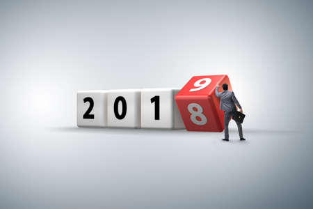 Businessman employee rotating cube to reveal number 2019の写真素材