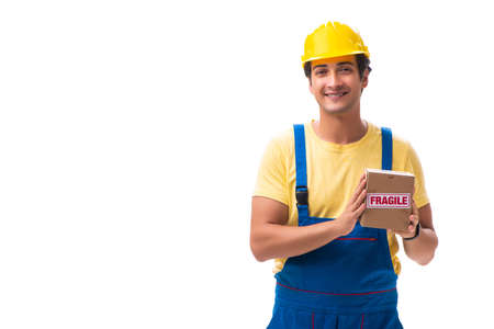 Young contractor with fragile boxes isolated on whiteの写真素材