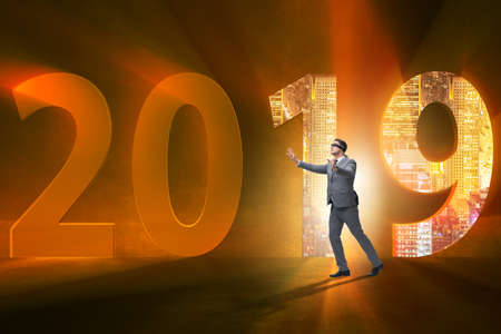 Businessman in the concept of transition to year 2019