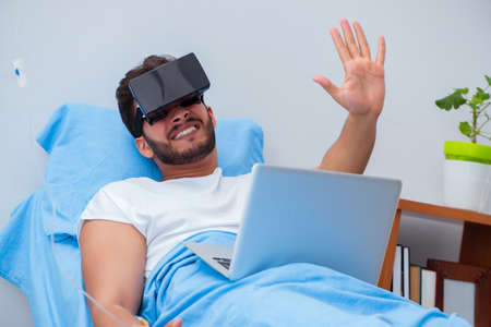 Patient in the hospital with VR glasses headset