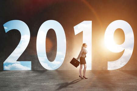 Businesswoman in the concept of transition to year 2019
