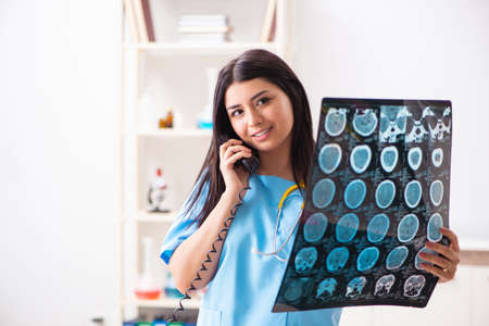 Young beautiful female doctor working in the clinic