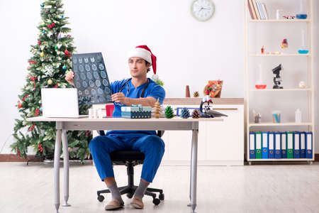 Doctor with gift box in the hospitalの写真素材