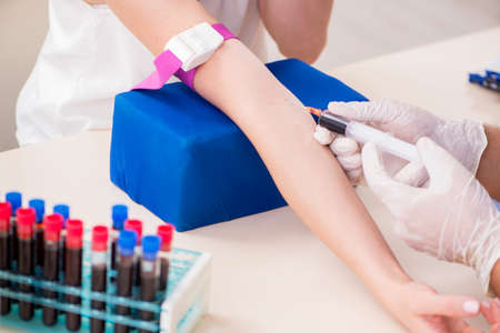Young patient during blood test sampling procedureの写真素材