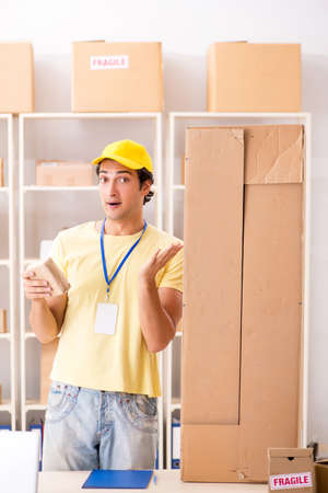 Handsome contractor working in box delivery relocation serviceの写真素材