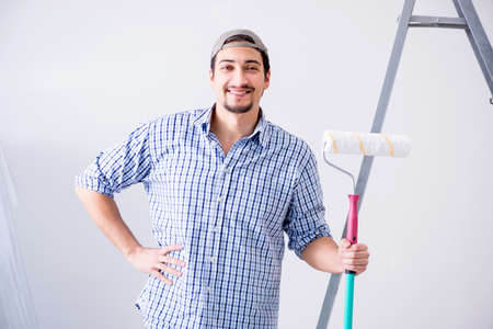 Young painter doing renovation at homeの写真素材