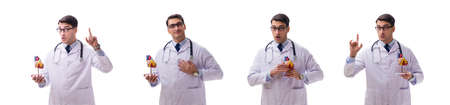 Young doctor with heart shape isolated on whiteの写真素材