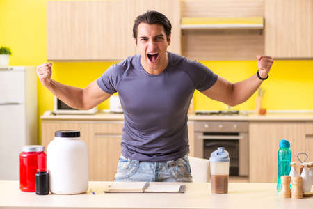 Young man blogging about food supplementsの写真素材