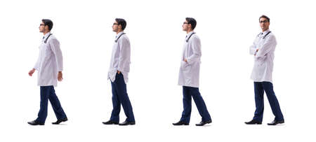 Young doctor physician standing walking isolated on white backgrの写真素材
