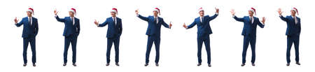 Young busnessman wearing santa hat in christmas concept on whiteの写真素材