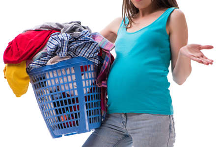 Woman holding basket of dirty clothing requiring washingの写真素材