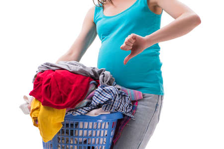 Woman holding basket of dirty clothing requiring washingの写真素材