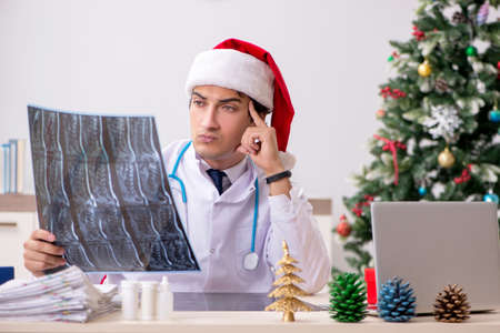 Doctor on the shift on christmas eveの写真素材