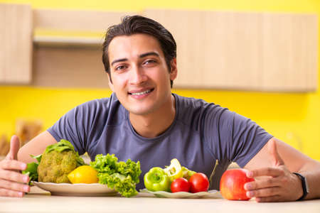Young man in dieting and healthy eating conceptの写真素材