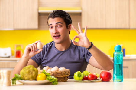 Young man in dieting and healthy eating conceptの写真素材