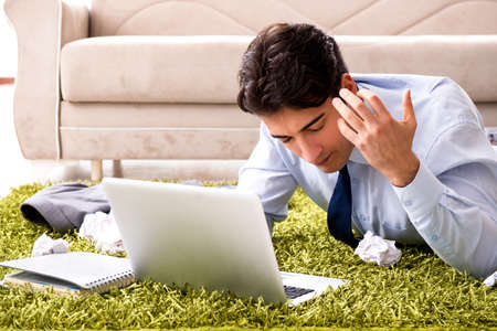 Young handsome man working under startup project at home