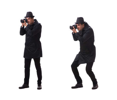 Spy with camera taking pictures isolated on whiteの写真素材