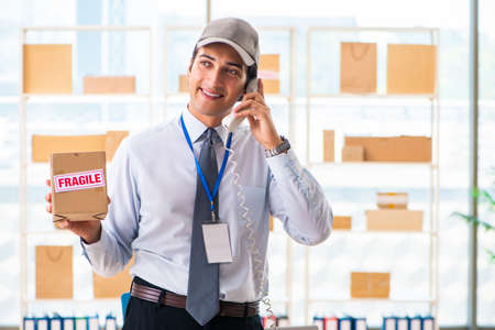 Male employee working in box delivery relocation serviceの写真素材