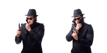Man spy with handgun isolated on white backgroundの写真素材