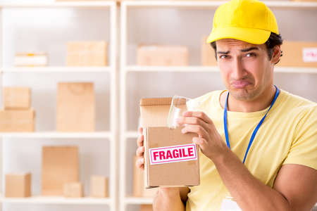 Handsome contractor working in box delivery relocation serviceの写真素材