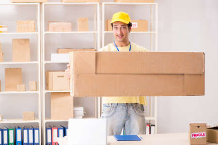 Handsome contractor working in box delivery relocation serviceの写真素材