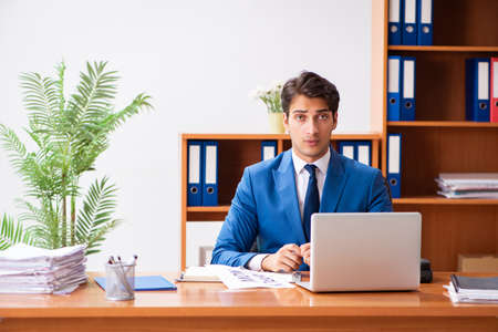 Young employee working in the officeの写真素材