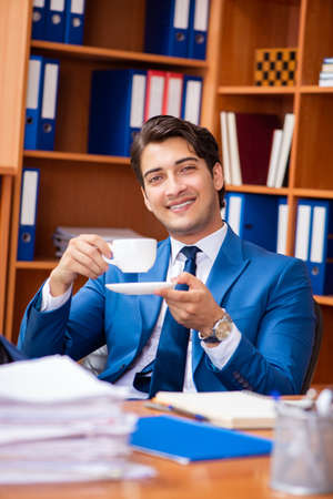 Young employee working in the officeの写真素材