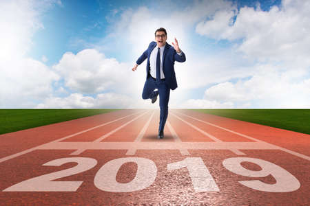 Businessman on finishing line in race for 2019の写真素材