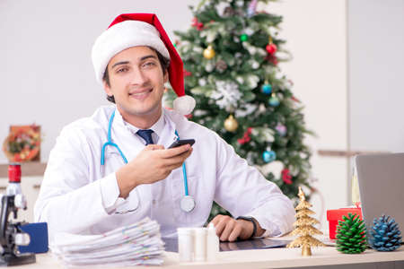Doctor on the shift on christmas eveの写真素材