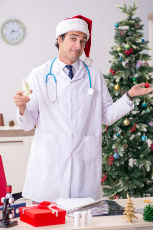 Doctor with gift box in the hospitalの写真素材
