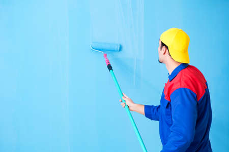 Young painter doing renovation at homeの写真素材