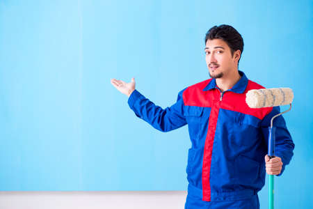Young painter doing renovation at home