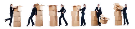 Businesswoman with boxes isolated on whiteの写真素材