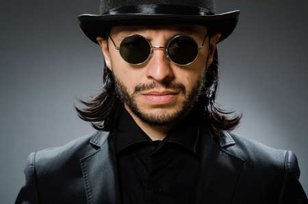 Vintage concept with man wearing black top hat