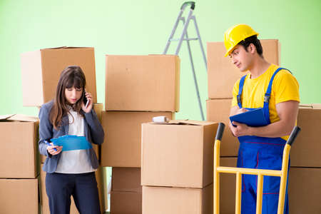 Woman boss and man contractor working with boxes delivery