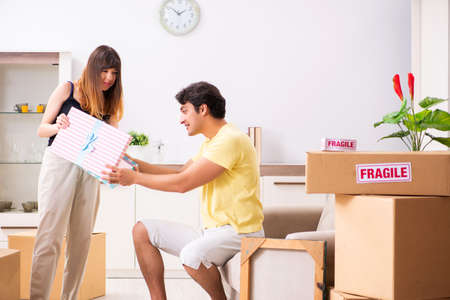 Young pair moving to new flat with fragile things