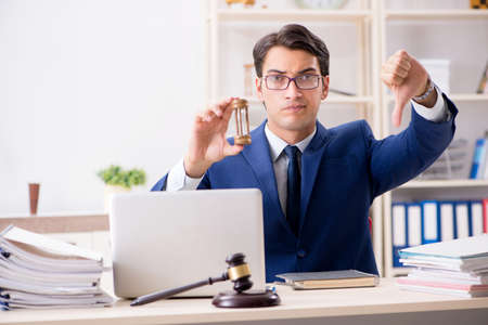 Young handsome judge working in courtの写真素材