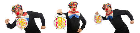 Funny clown with clock isolated on whiteの写真素材