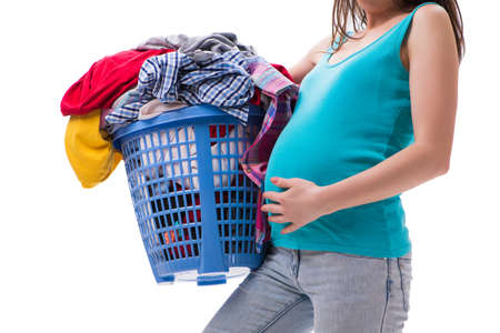 Woman holding basket of dirty clothing requiring washingの写真素材
