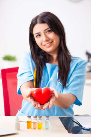 Young beautiful female doctor working in the clinicの写真素材
