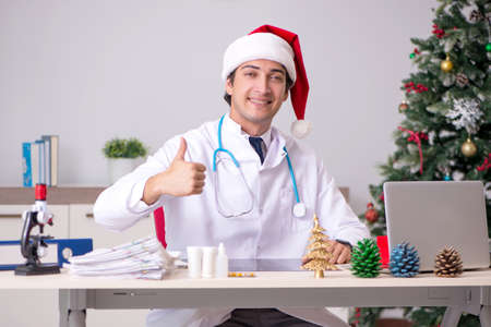 Doctor on the shift on christmas eveの写真素材