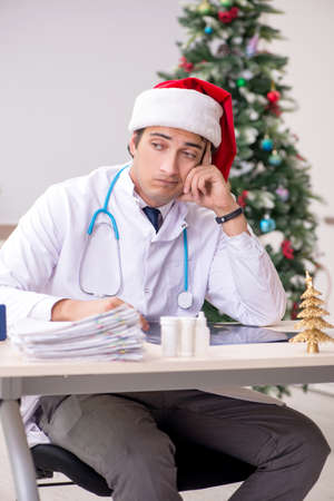 Doctor on the shift on christmas eveの写真素材
