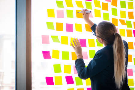 Beautiful female employee with many conflicting priorities