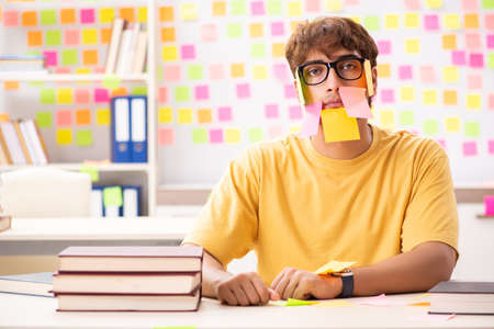 Student preparing for exams with many conflicting prioritiesの写真素材