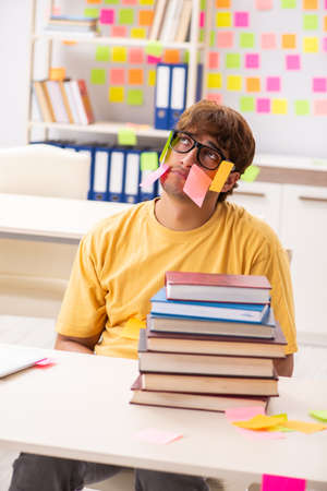 Student preparing for exams with many conflicting prioritiesの写真素材