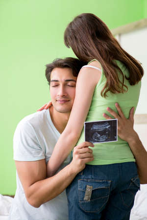 Young family finding out about pregnancyの写真素材