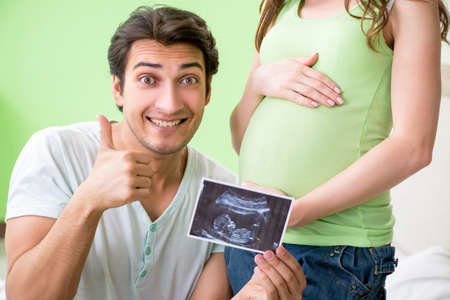 Young family finding out about pregnancyの写真素材