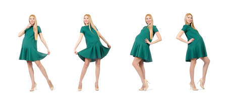 Beautiful pregnant woman in green dress isolated on whiteの写真素材
