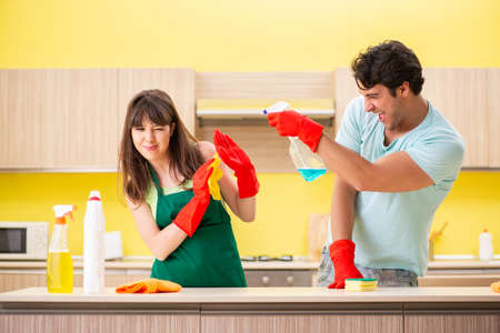Young couple working at kitchen